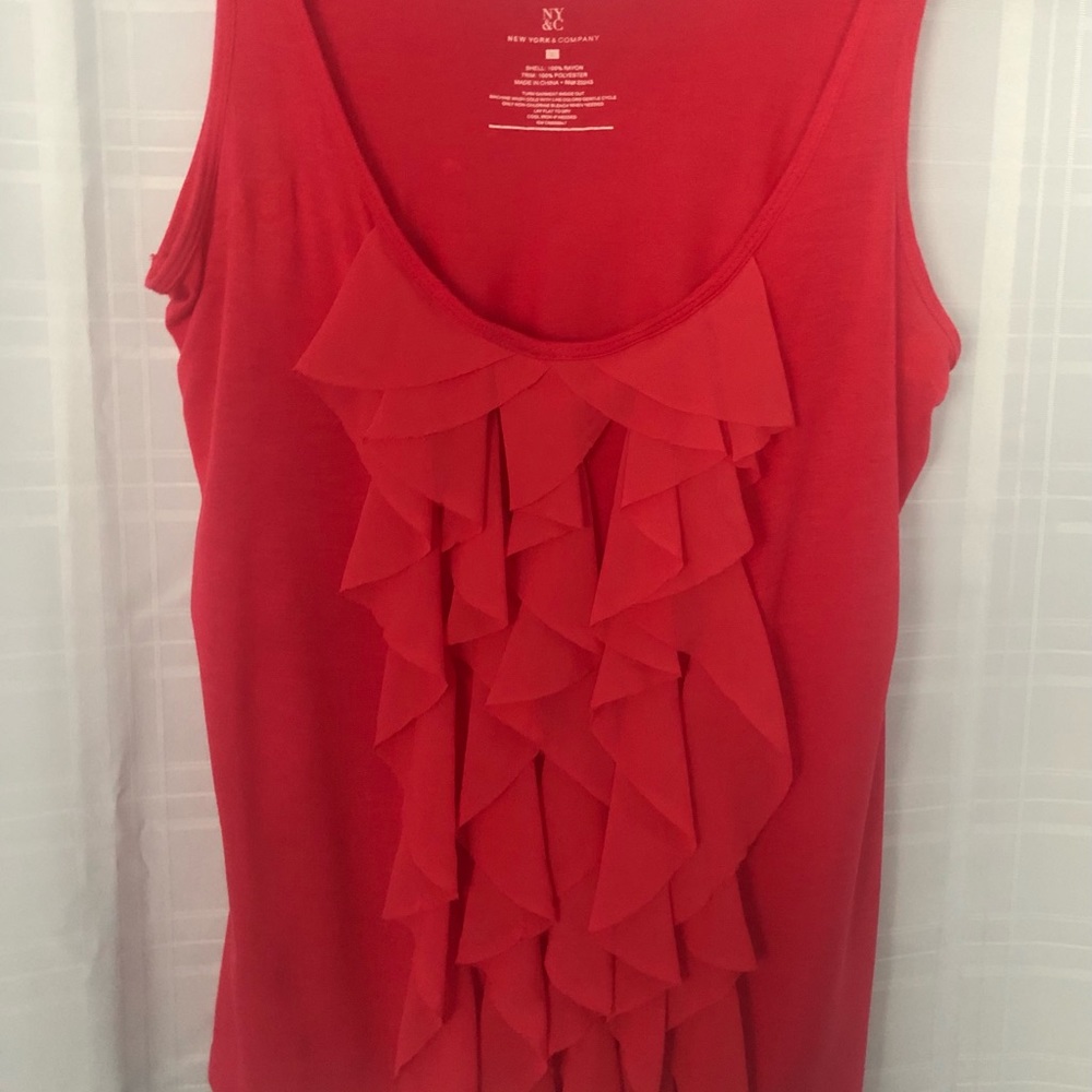 Pink ruffled top.